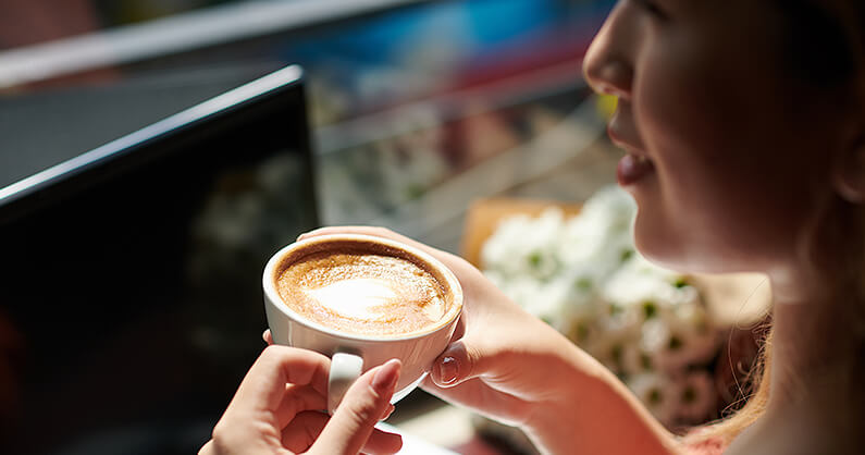 Drinking coffee in Brisbane with a laptop