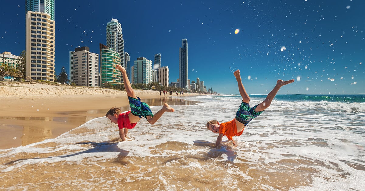 Kids having fun at Gold Coast beach | Austate Removals