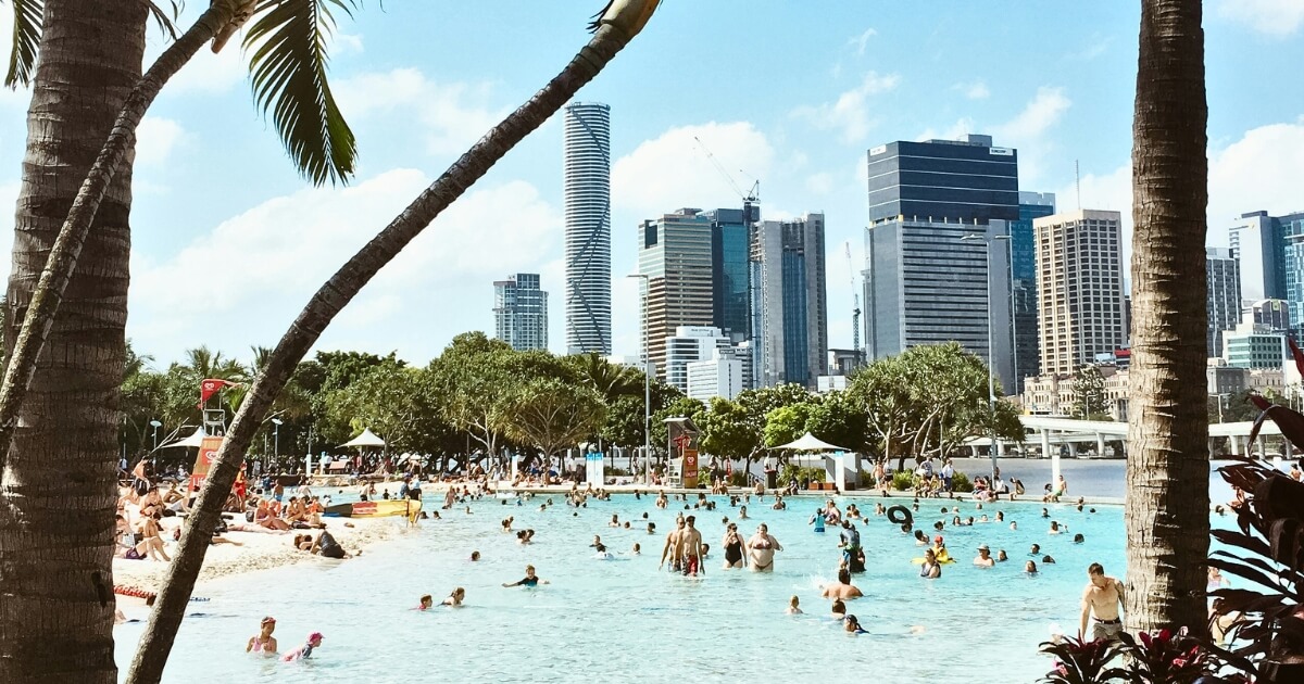 Brisbane Southbank lagoon with people swimming. Free entertainment