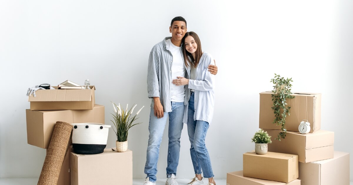Happy couple looking at renting in 2023