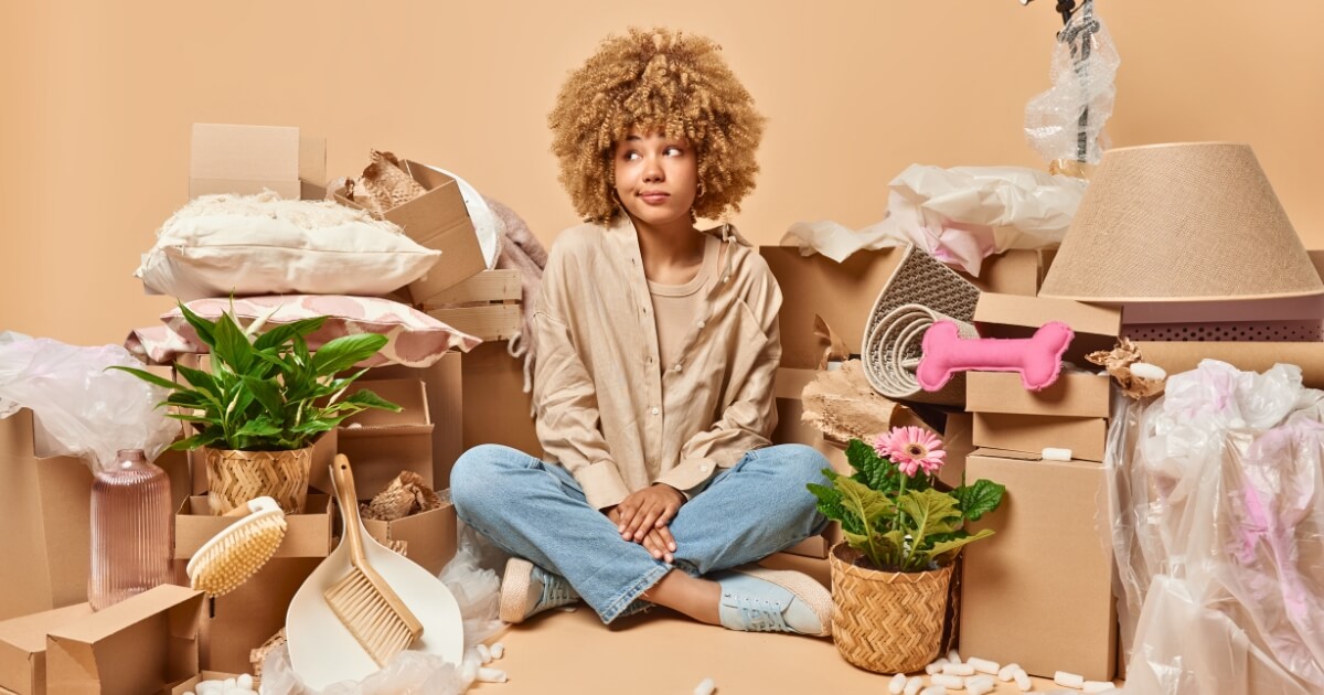 Women sitting in a pile and decluttering