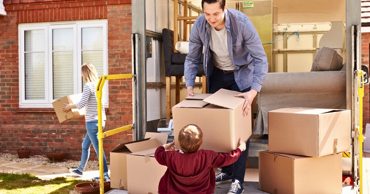 Child helping dad move