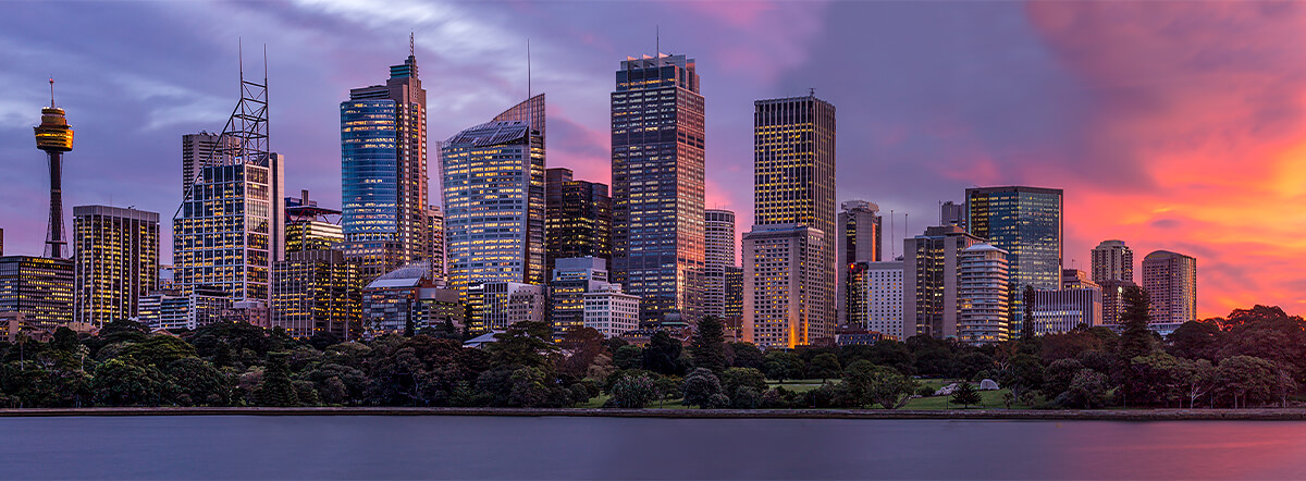 Sunset colours reflecting off Sydney skyline at dusk