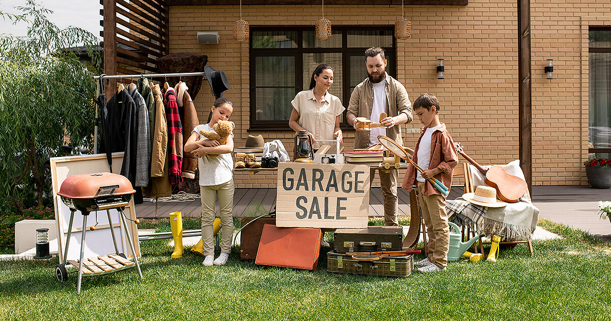 Family prepare for garage sale before interstate move
