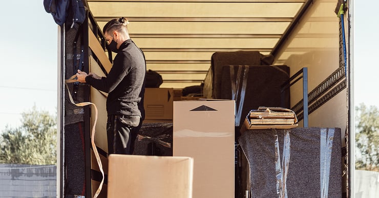 Truck full of furniture and boxes ready to move into storage