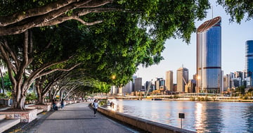 People walking and jogging on riverfront in Brisbane's South Bank