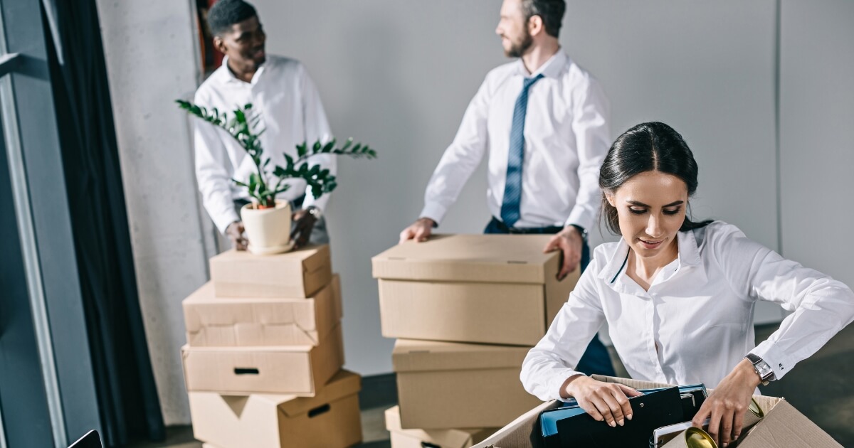 People packing office supplies