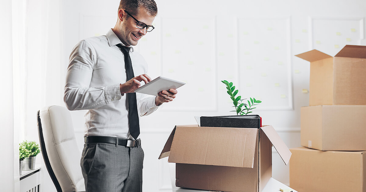 Man continues business work while removalists have been packing