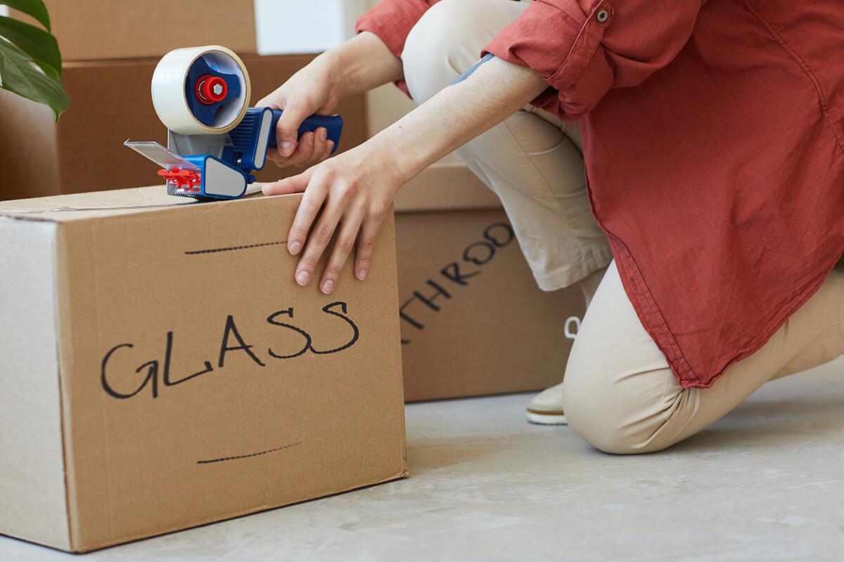 Woman packing box ready for local house move