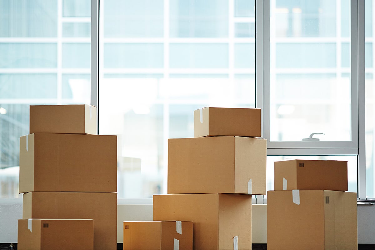 Stacks of packing boxes Gold Coast stand in front of well lit window