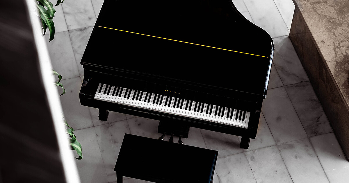 Grand piano top view with piano bench