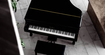 Grand piano top view with piano bench