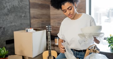 Women packing for a move