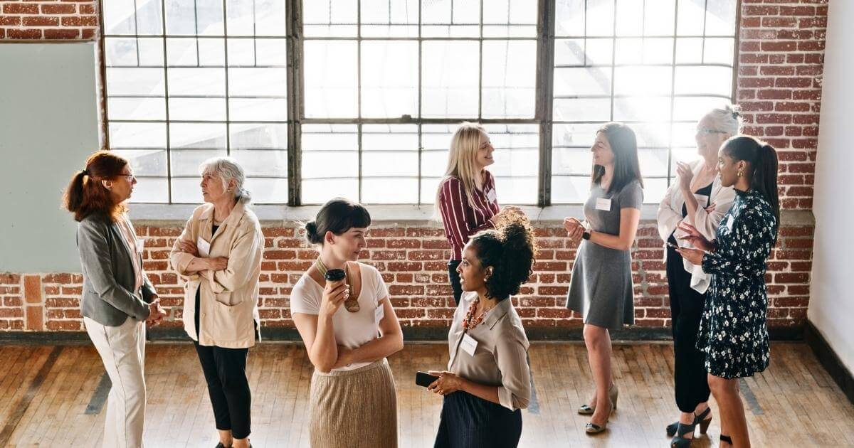 Women at a business networking event chatting
