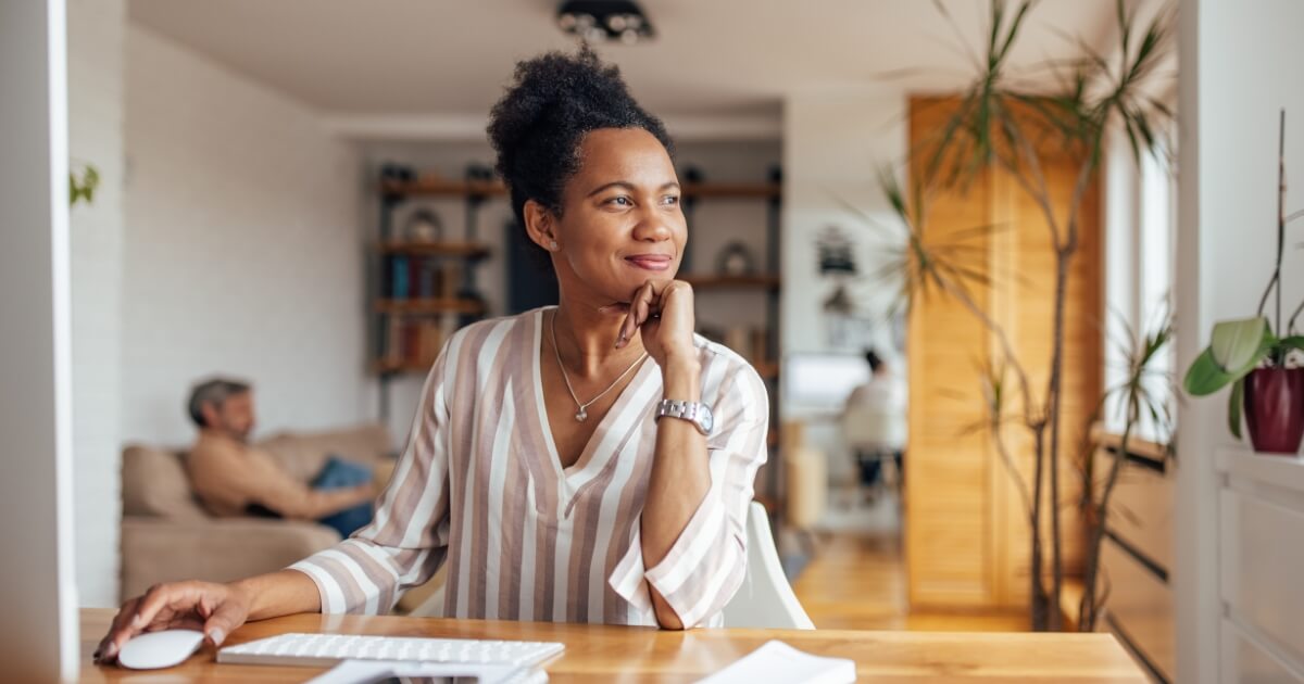Women sitting at a desk planning her eco friendly move