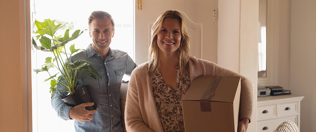 Couple moving last items out of home before they move house