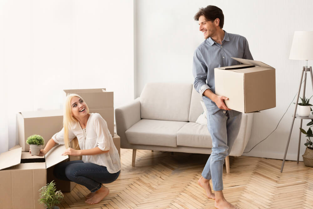 A young couple packing boxes ready for the removals