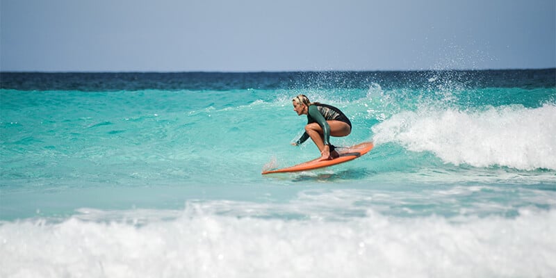 Woman surfing in Western Australia