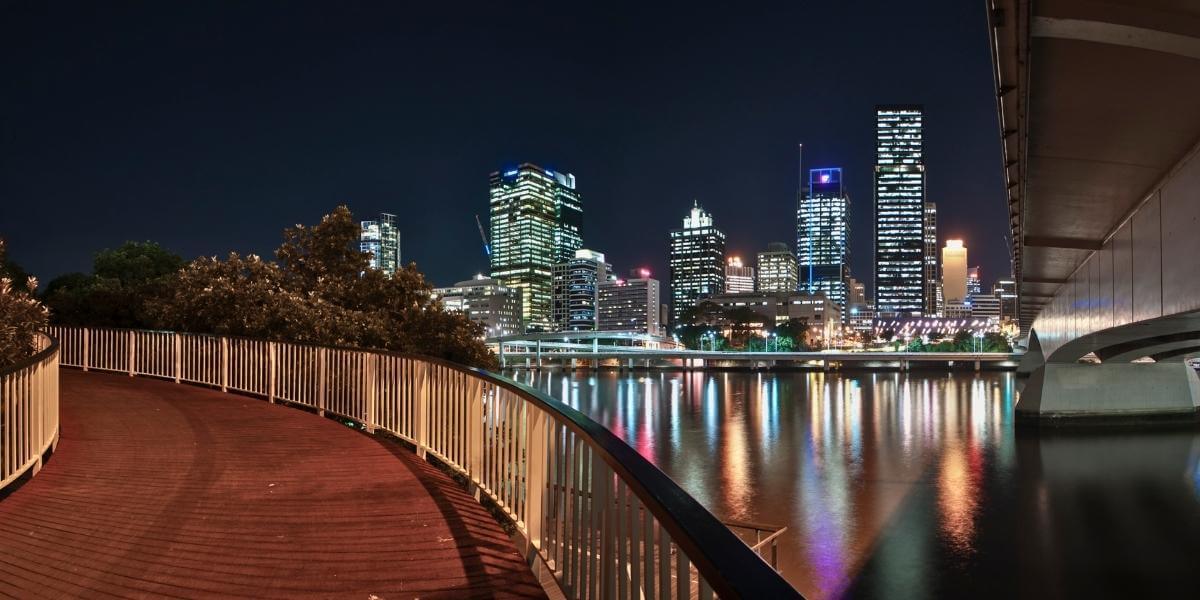 Brisbane Riverside suburb at night with view of the city