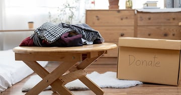 Table for donation with clothes and furniture