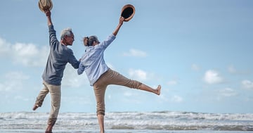 Happy retirement couple at beach