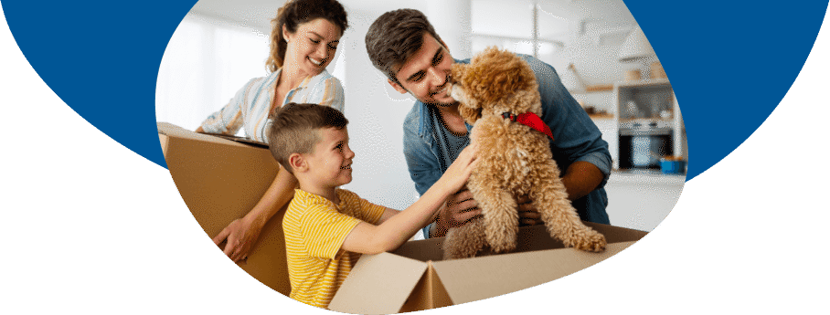 Family with boxes and dog